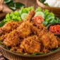 Cara Membuat Ayam Goreng Lengkuas, Ungkep Bumbu Kuning Jadi Makin Gurih
(Foto: dapurkobe
/disway/AI)